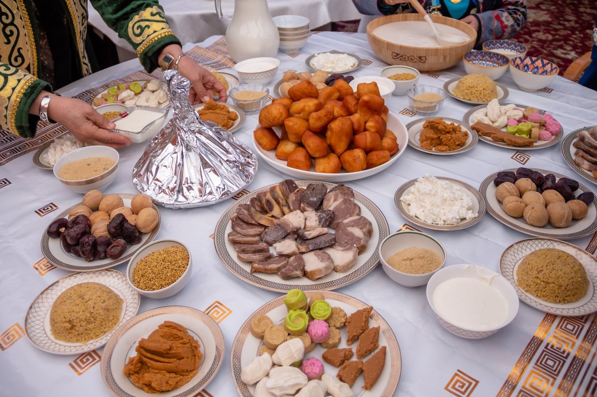 A spread of traditional Somali food and small bites on a festive table